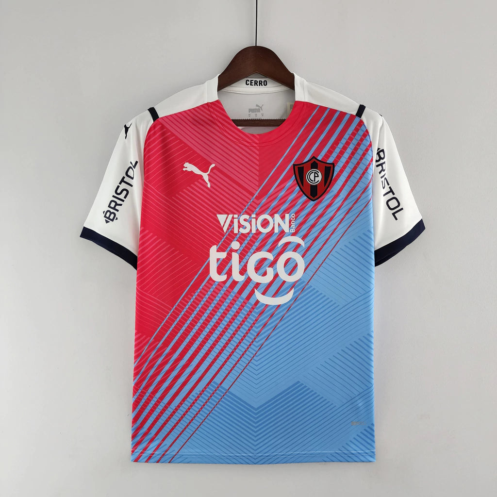 Camisa Cerro Portenho II (Away) 23/24 - Torcedor Masculina - Branco, Azul e Rosa - Manto Elegante