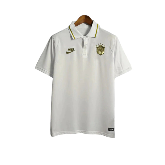 Camisa do Brasil 22/23 - Torcedor Masculina - Polo / Branco-Gold - Manto Elegante