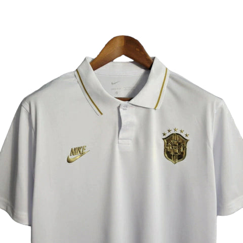 Camisa do Brasil 22/23 - Torcedor Masculina - Polo / Branco-Gold - Manto Elegante